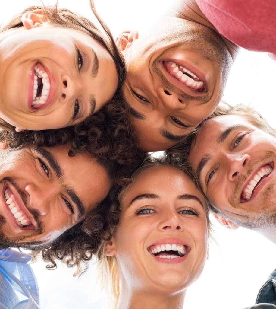 Smiling person showcasing white teeth after laser whitening treatment Derby